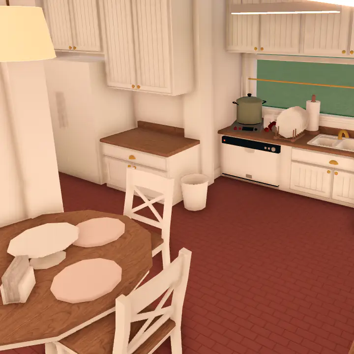 Small kitchen with a small dining table.